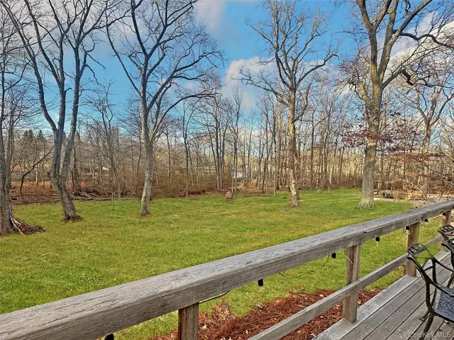 a view of a backyard and trees