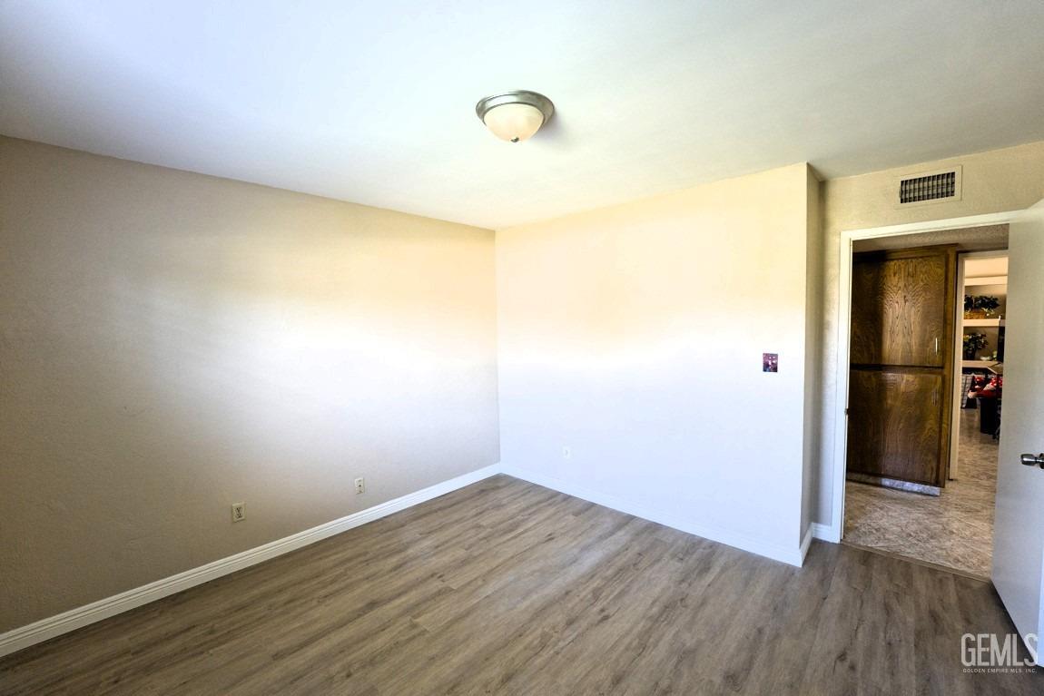 Undisclosed Address Bakersfield, CA 93309 - Photo 16 of 37 a view of a room with wooden floor