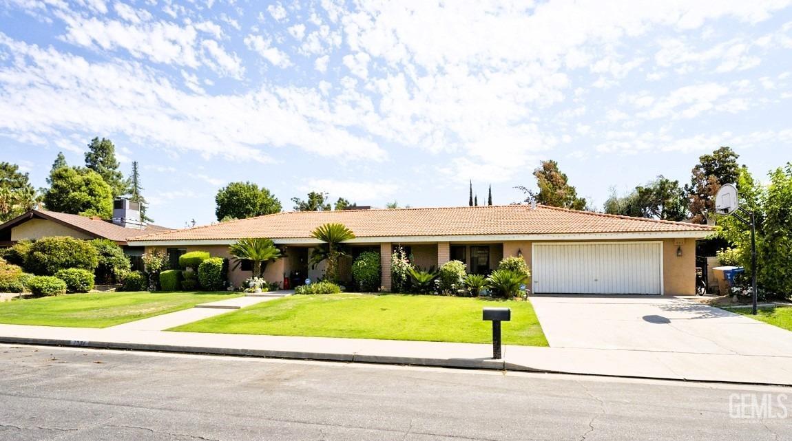 Undisclosed Address Bakersfield, CA 93309 - Photo 2 of 37 a view of house with a garden