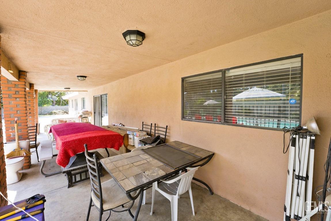 Undisclosed Address Bakersfield, CA 93309 - Photo 29 of 37 a view of a dining room with furniture and a large window