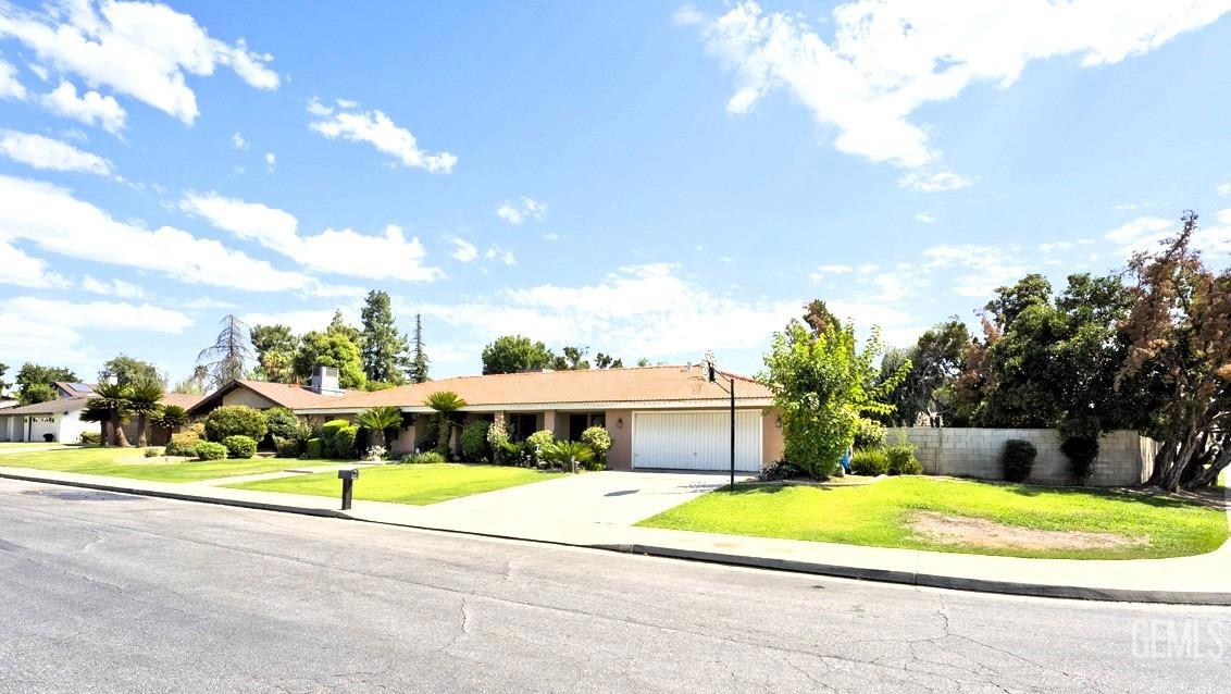 Undisclosed Address Bakersfield, CA 93309 - Photo 3 of 37 a front view of house with yard and entertaining space