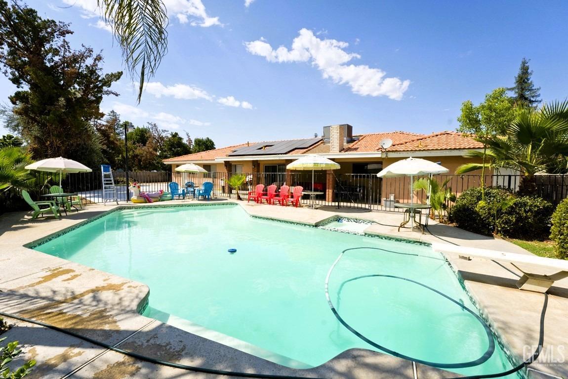 Undisclosed Address Bakersfield, CA 93309 - Photo 32 of 37 a swimming pool with outdoor seating yard and barbeque oven