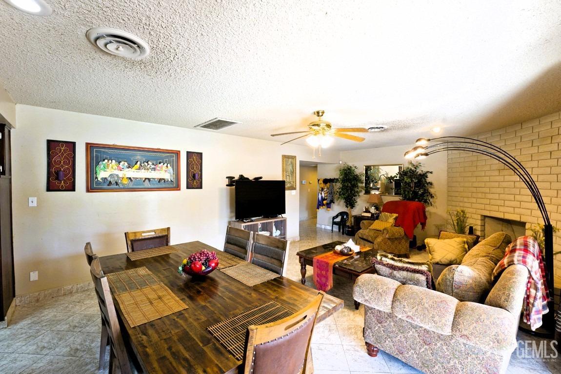 Undisclosed Address Bakersfield, CA 93309 - Photo 6 of 37 a living room with furniture and a flat screen tv