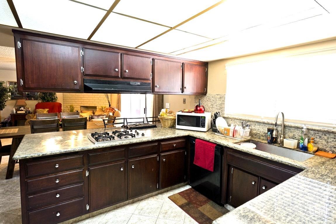 Undisclosed Address Bakersfield, CA 93309 - Photo 9 of 37 a kitchen with a sink and cabinets