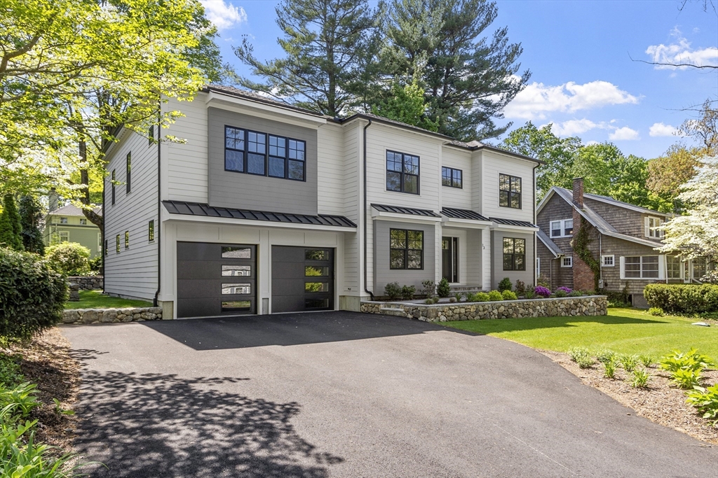 13 Woodland Road Lexington, MA 02420 - Photo 1 of 1 a front view of a house with a yard