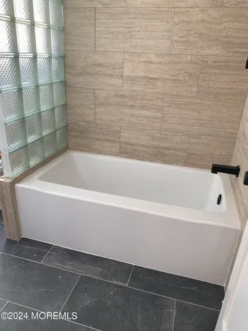 a bathroom with a bathtub