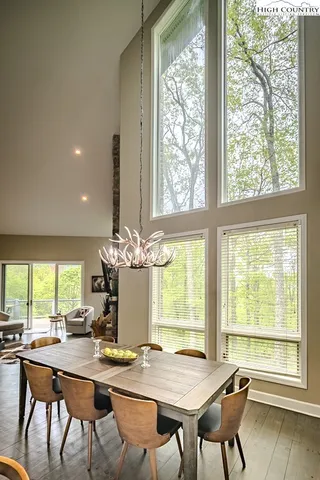 a view of a dining room with furniture and window