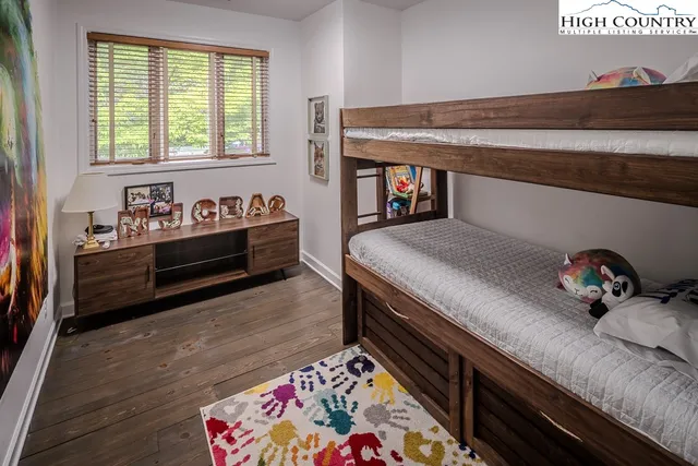 a bedroom with bed and window