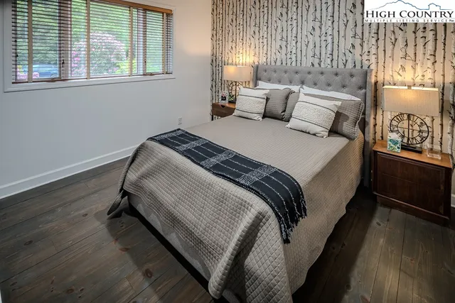 a bedroom with a bed and window