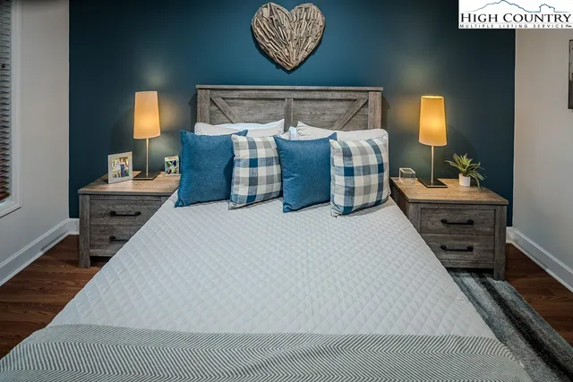 a bedroom with bed and window