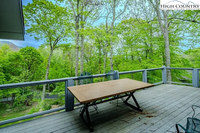 a view of a balcony with furniture