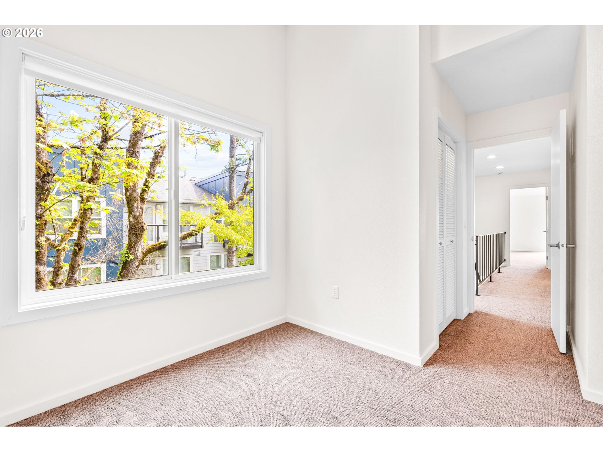 1442 Southwest 66th Avenue Portland, OR 97225 - Photo 23 of 31 a view of an empty room and a window