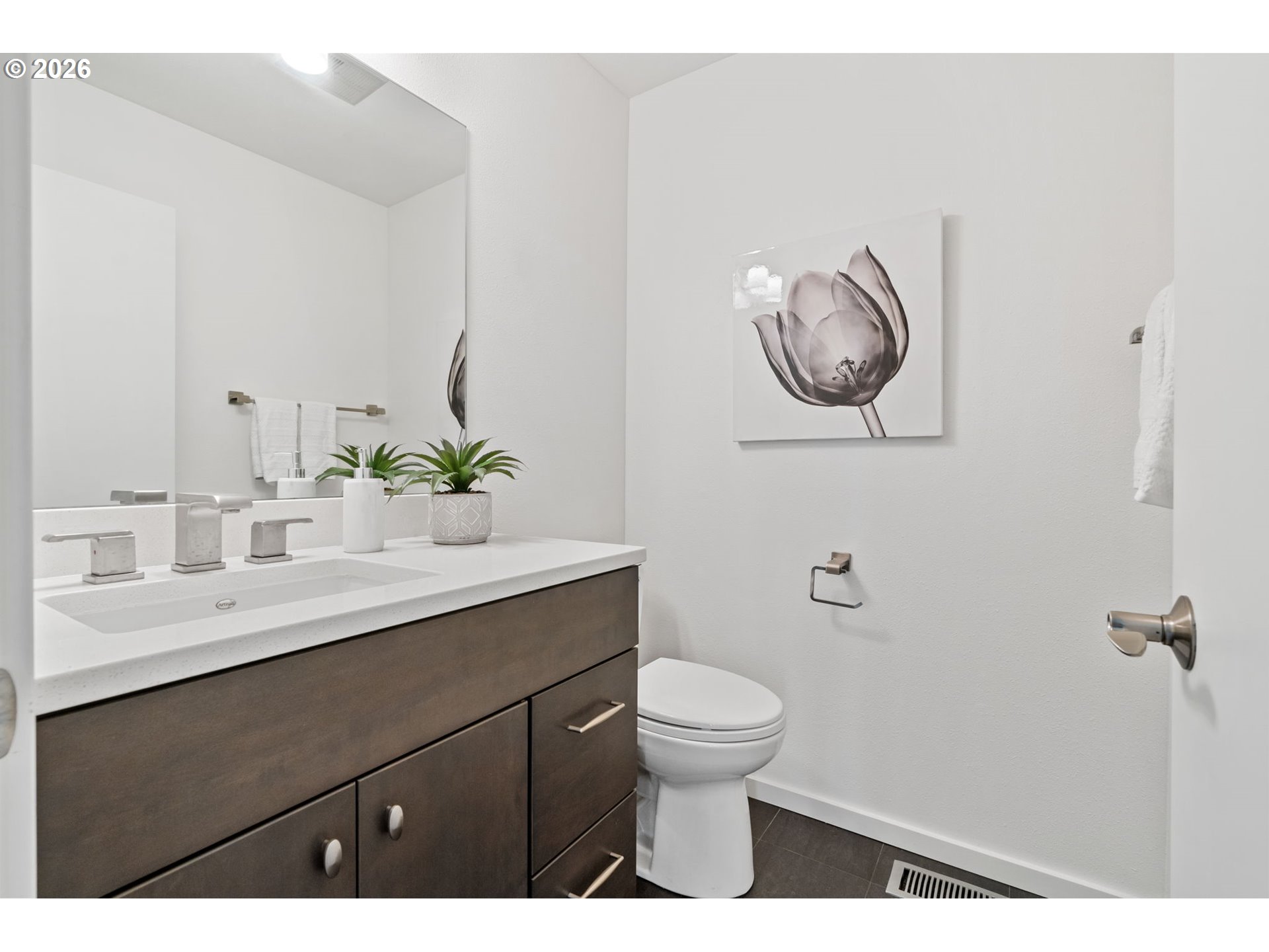 1442 Southwest 66th Avenue Portland, OR 97225 - Photo 5 of 31 a bathroom with a toilet sink and mirror