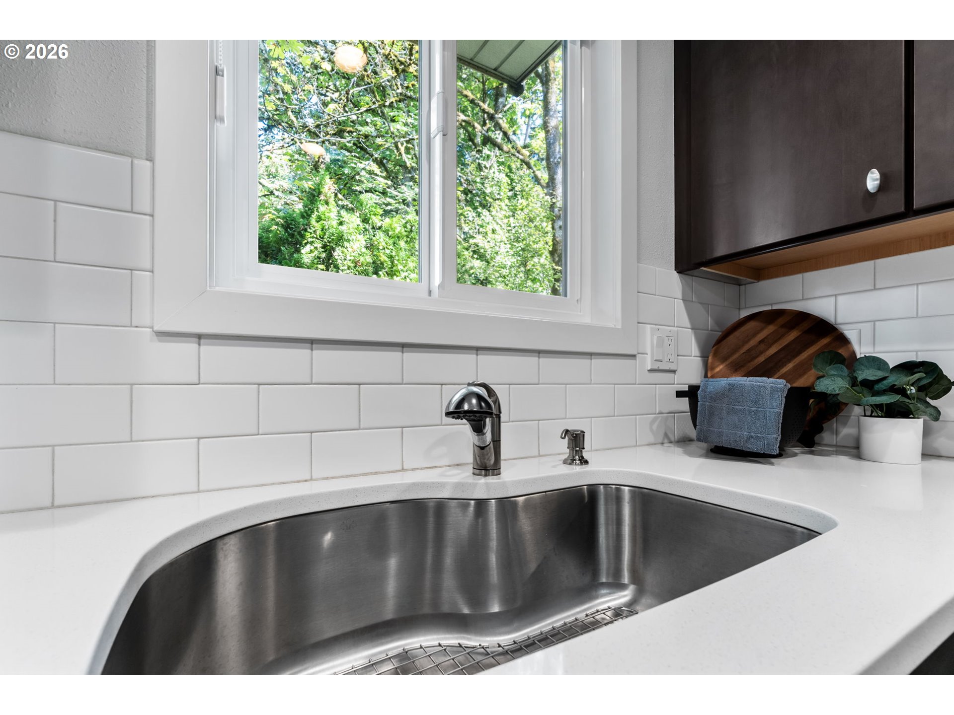 1442 Southwest 66th Avenue Portland, OR 97225 - Photo 10 of 31 a kitchen with a sink and a window