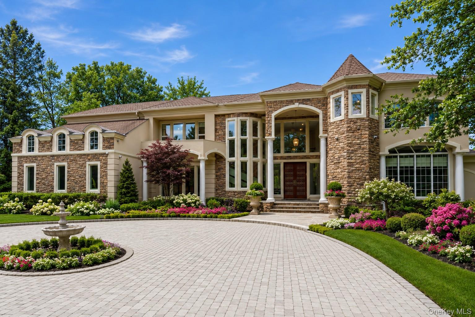 55 Coves Run Syosset, NY 11791 - Photo 1 of 50 a front view of a house with a garden