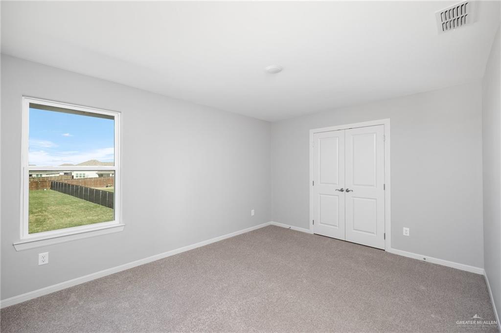 14616 Aqualina Way McAllen, TX 78504 - Photo 11 of 26 a view of an empty room with a window