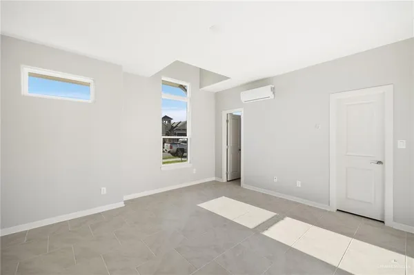 a view of a house with a yard from a lake view