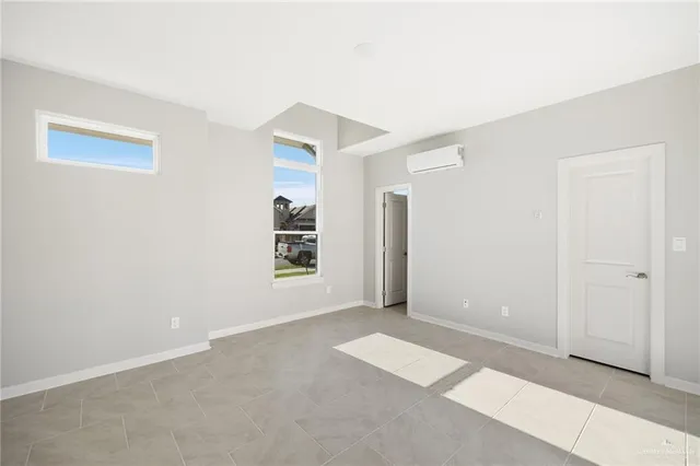 a view of a house with a yard from a lake view