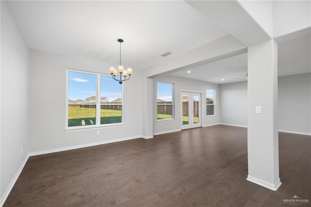 14616 Aqualina Way McAllen, TX 78504 - Photo 3 of 26 a view of an empty room with a chandelier fan and windows