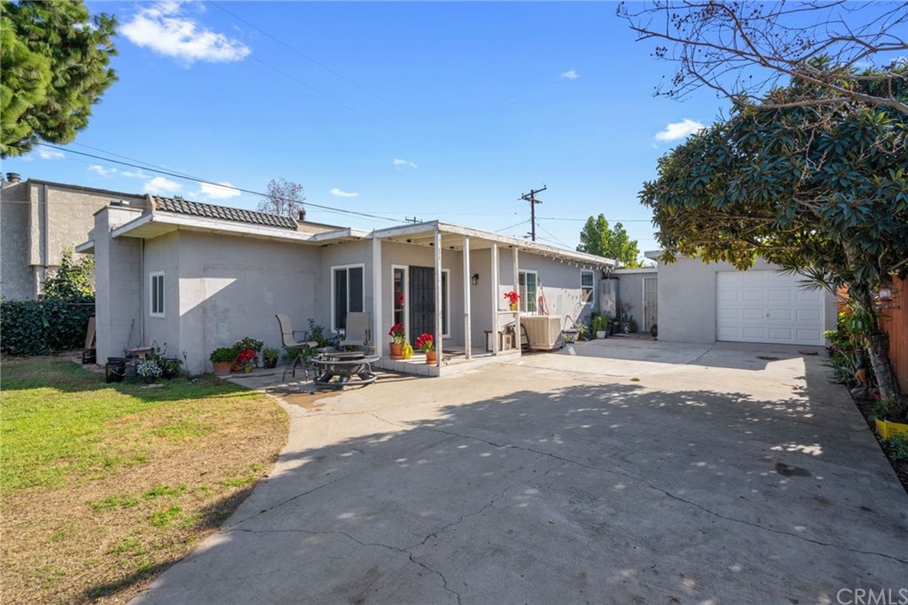 7620 Magnolia Avenue Riverside, CA 92504 - Photo 1 of 1 a view of a house with backyard and a tree