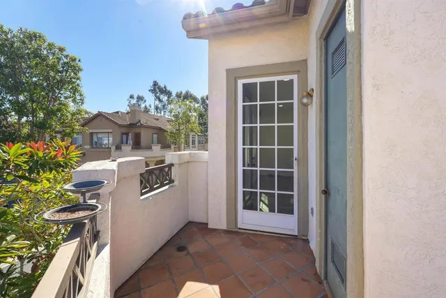 a view of a balcony with chairs