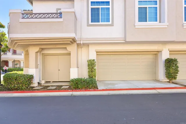a front view of a house with garage