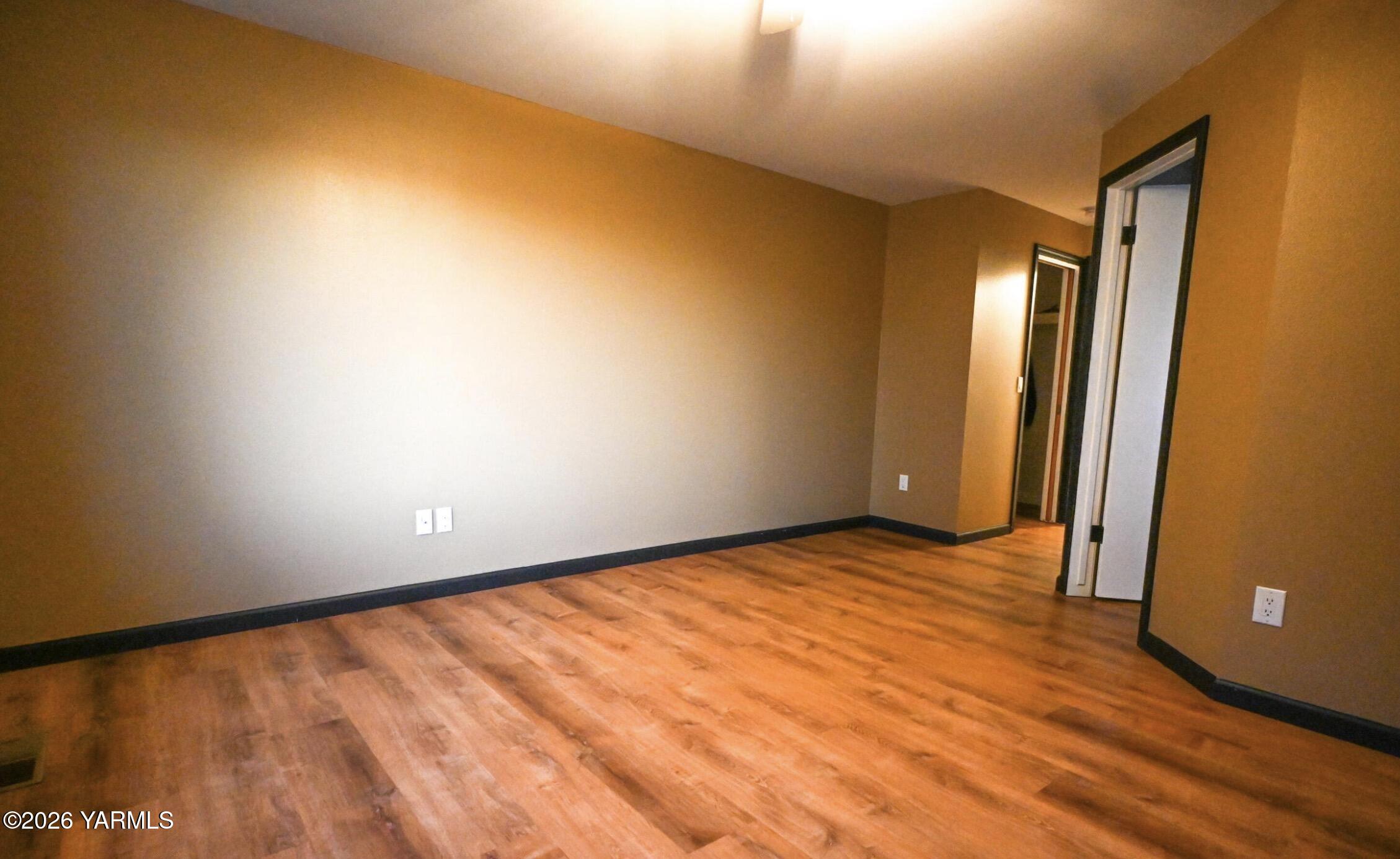 9621 Meadowbrook Road Yakima, WA 98903 - Photo 11 of 26 a view of an empty room and wooden floor