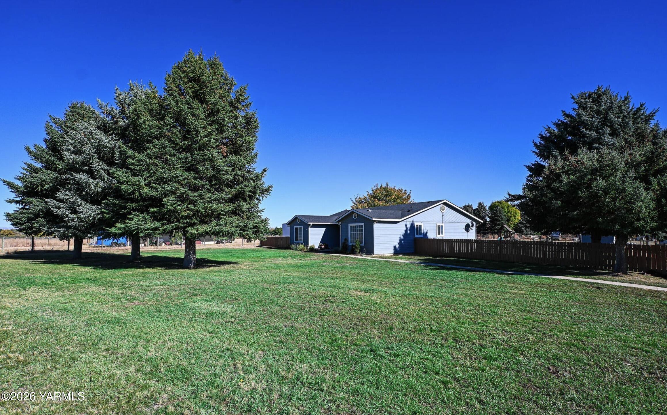 9621 Meadowbrook Road Yakima, WA 98903 - Photo 22 of 26 a view of a house with a big yard