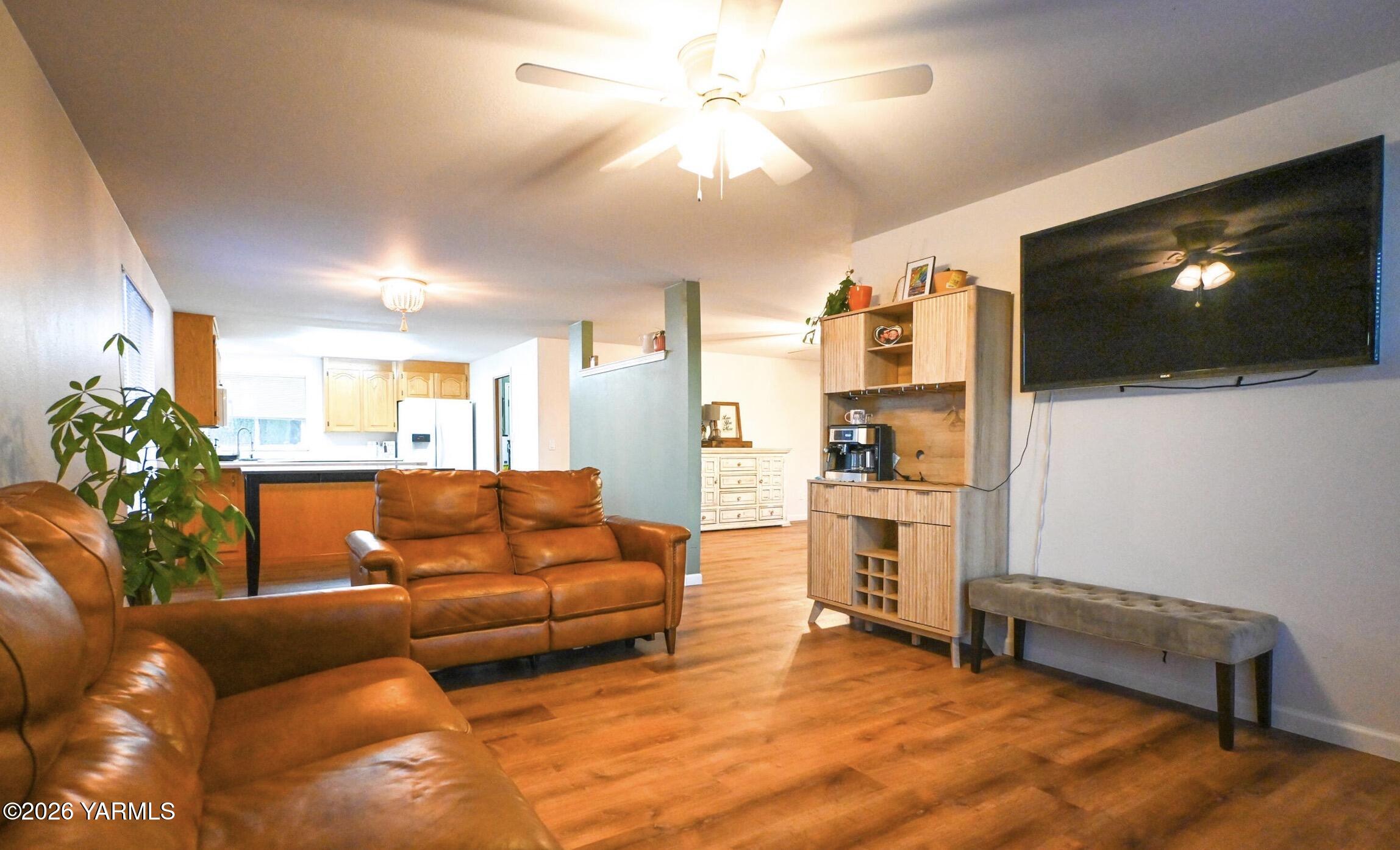 9621 Meadowbrook Road Yakima, WA 98903 - Photo 7 of 26 a living room with furniture and a flat screen tv
