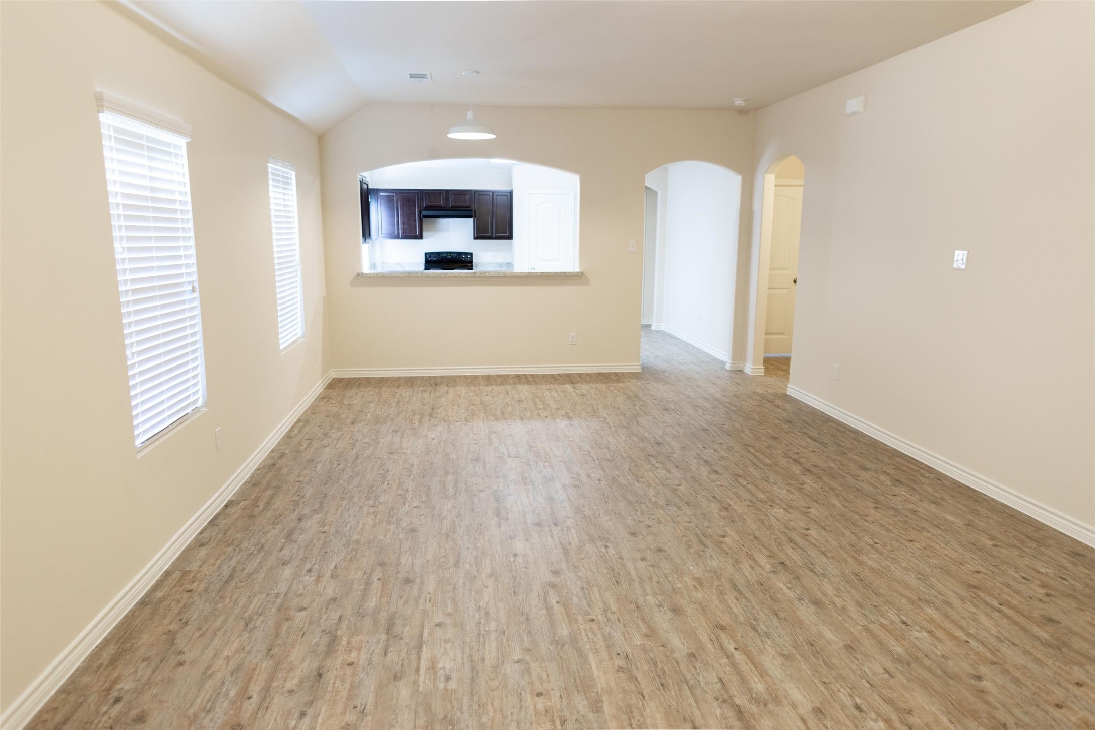 13815 Winding Path Lane Willis, TX 77378 - Photo 7 of 13 a view of a room with wooden floor and a window