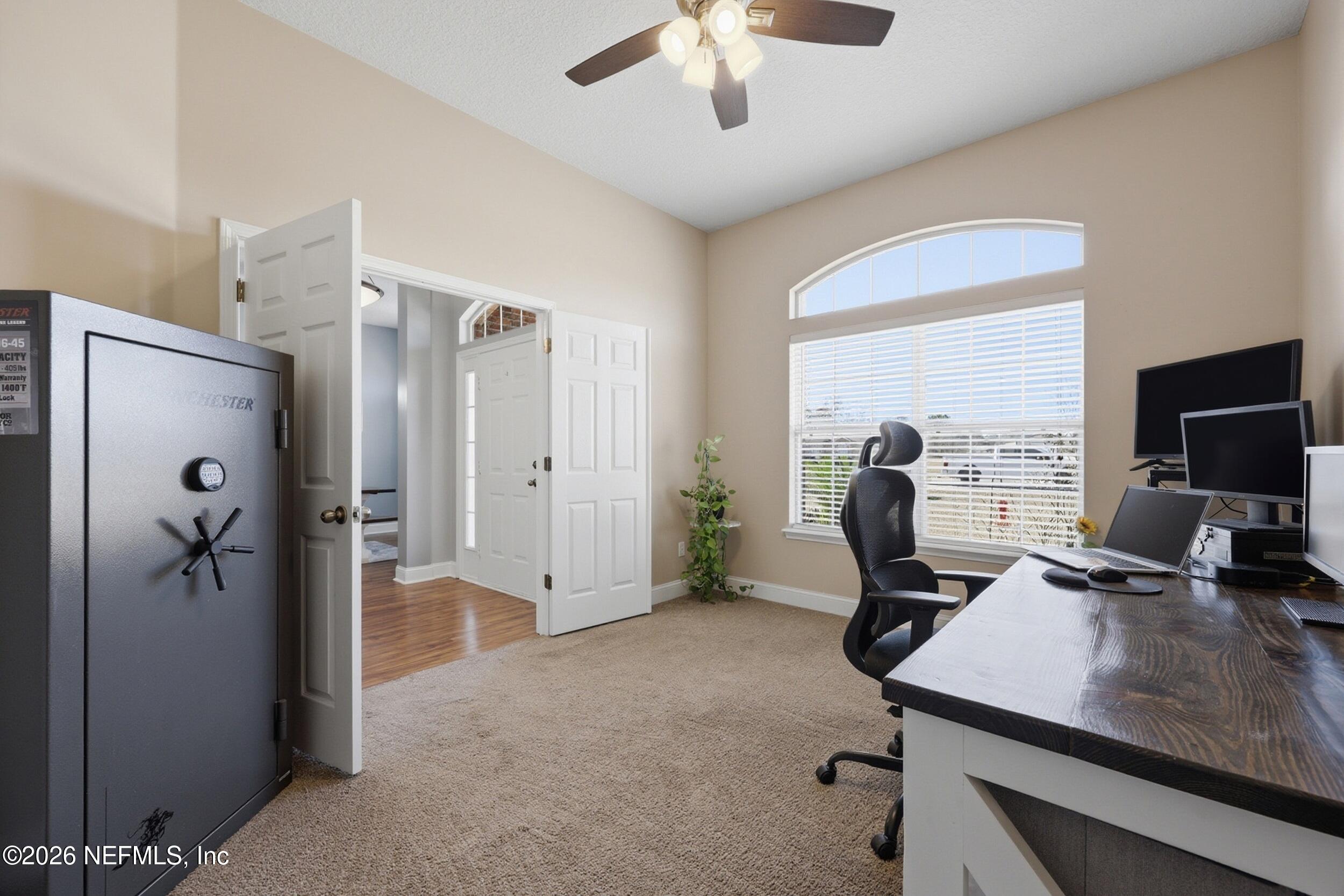 44808 Green Meadows Lane Callahan, FL 32011 - Photo 12 of 41 a view of a workspace with furniture and a window