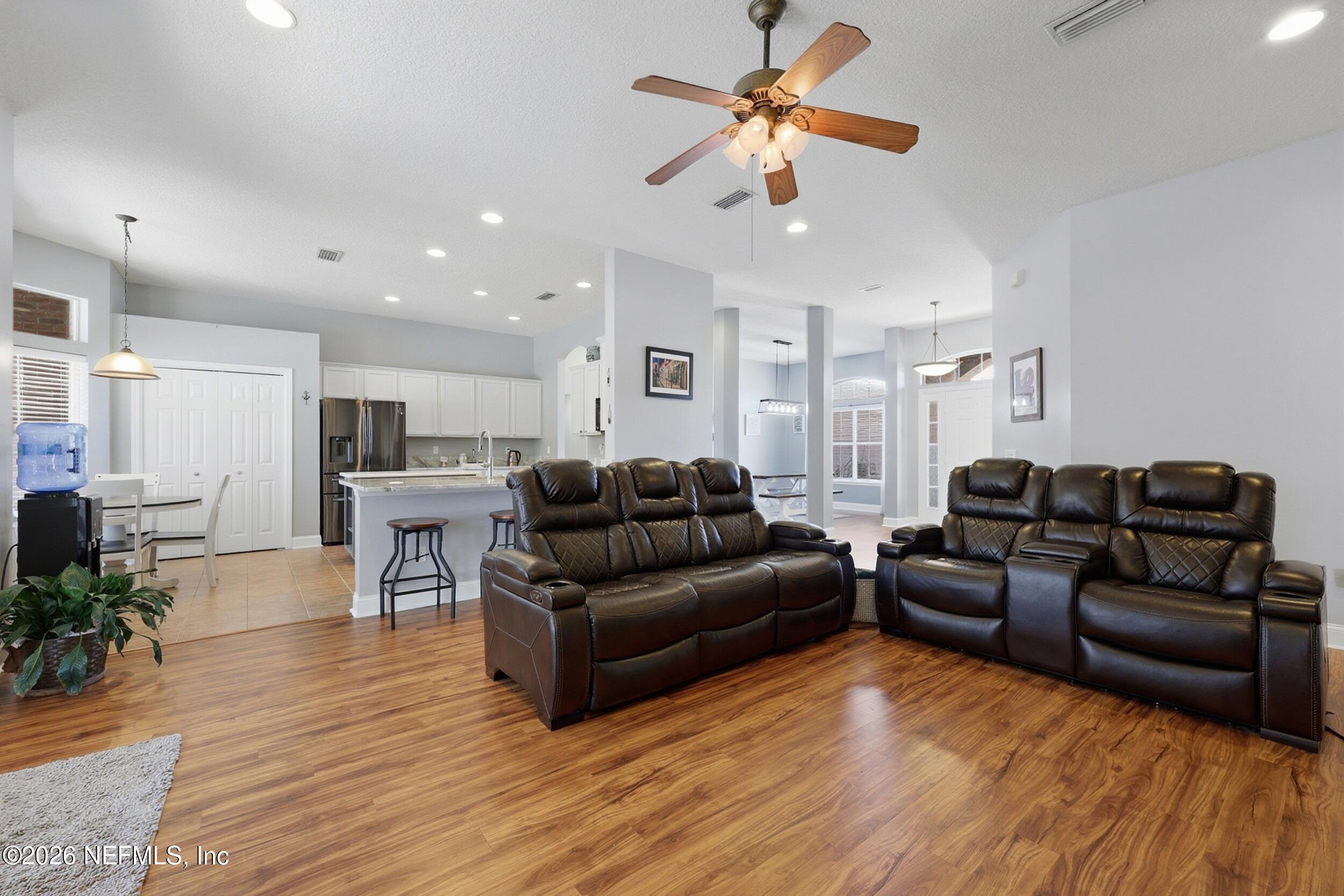 44808 Green Meadows Lane Callahan, FL 32011 - Photo 16 of 41 a living room with furniture and wooden floor
