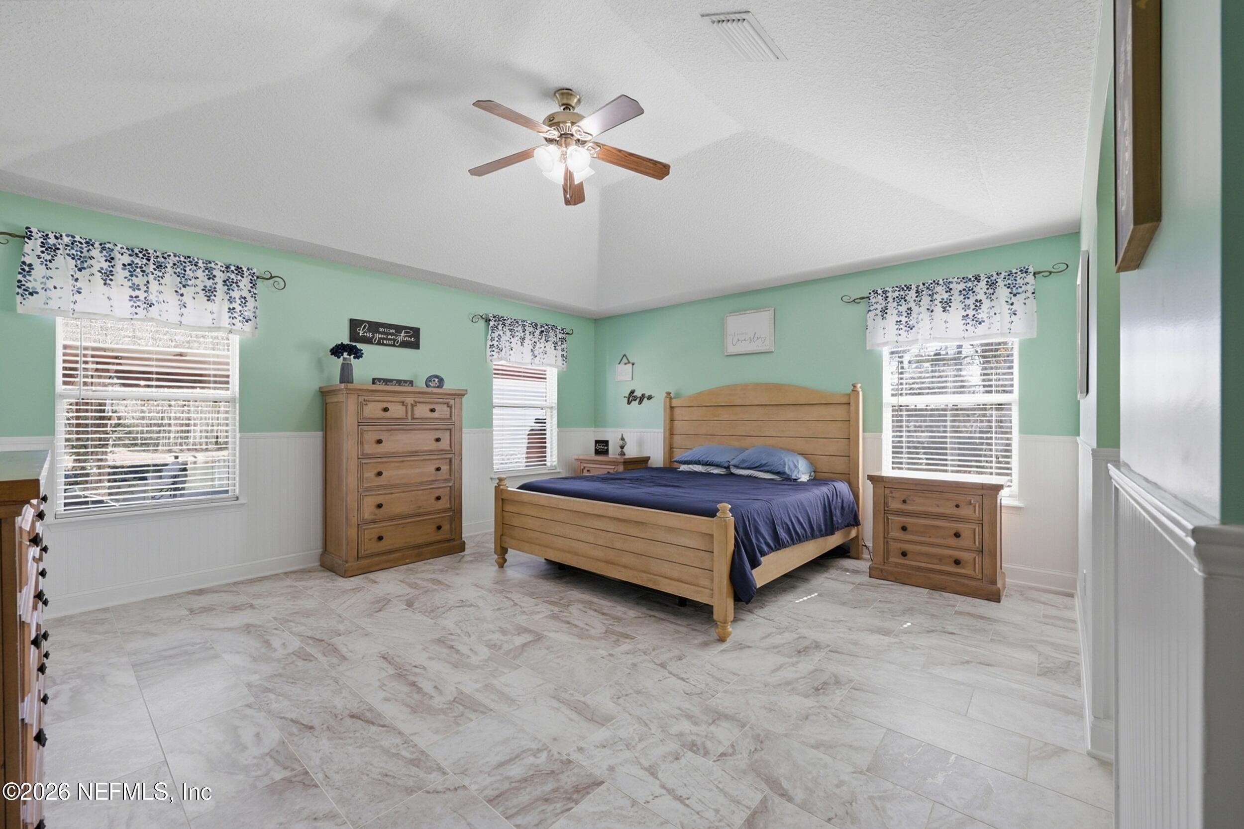 44808 Green Meadows Lane Callahan, FL 32011 - Photo 17 of 41 a bedroom with a bed and ceiling fan