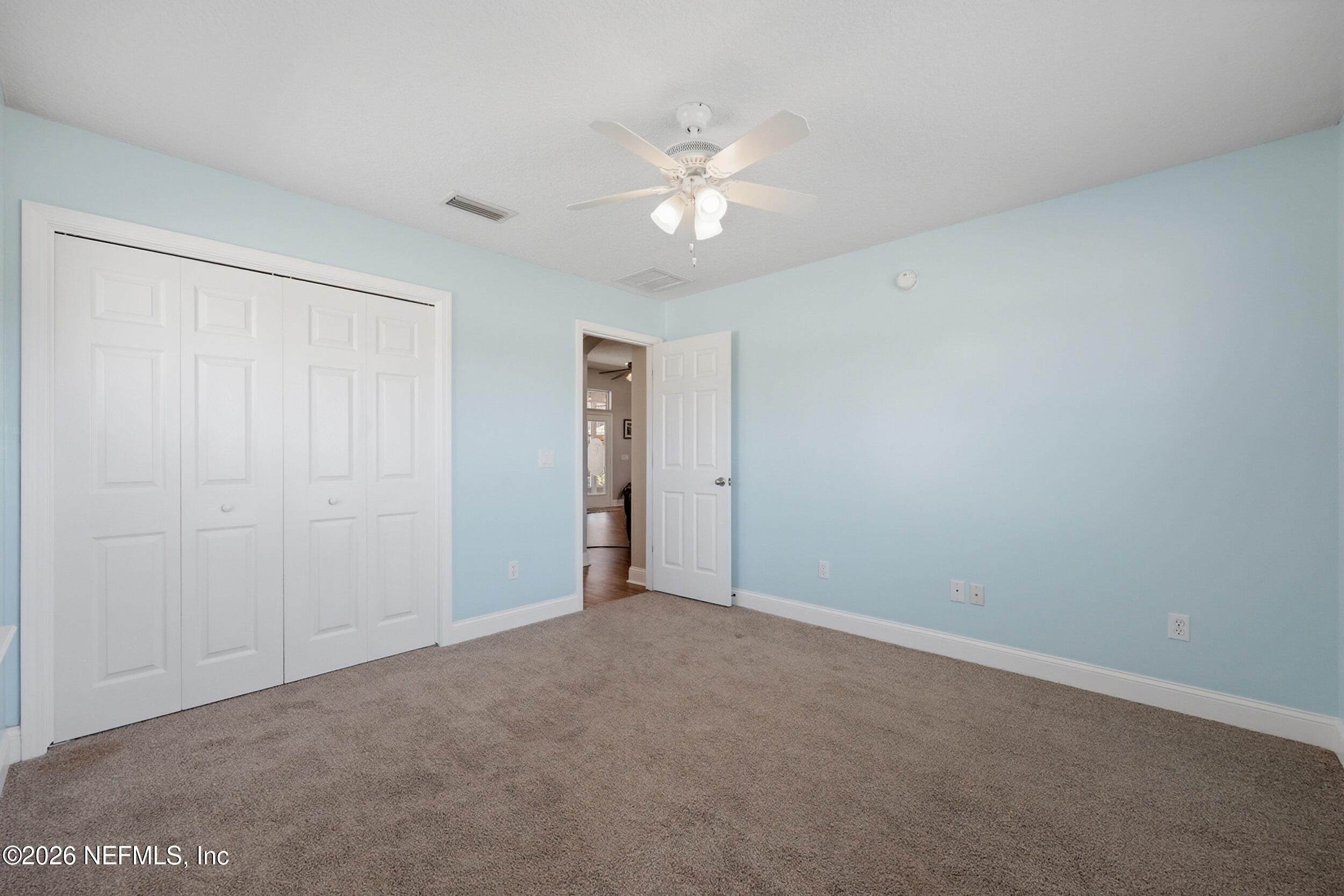 44808 Green Meadows Lane Callahan, FL 32011 - Photo 21 of 41 a view of an empty room with a chandelier fan