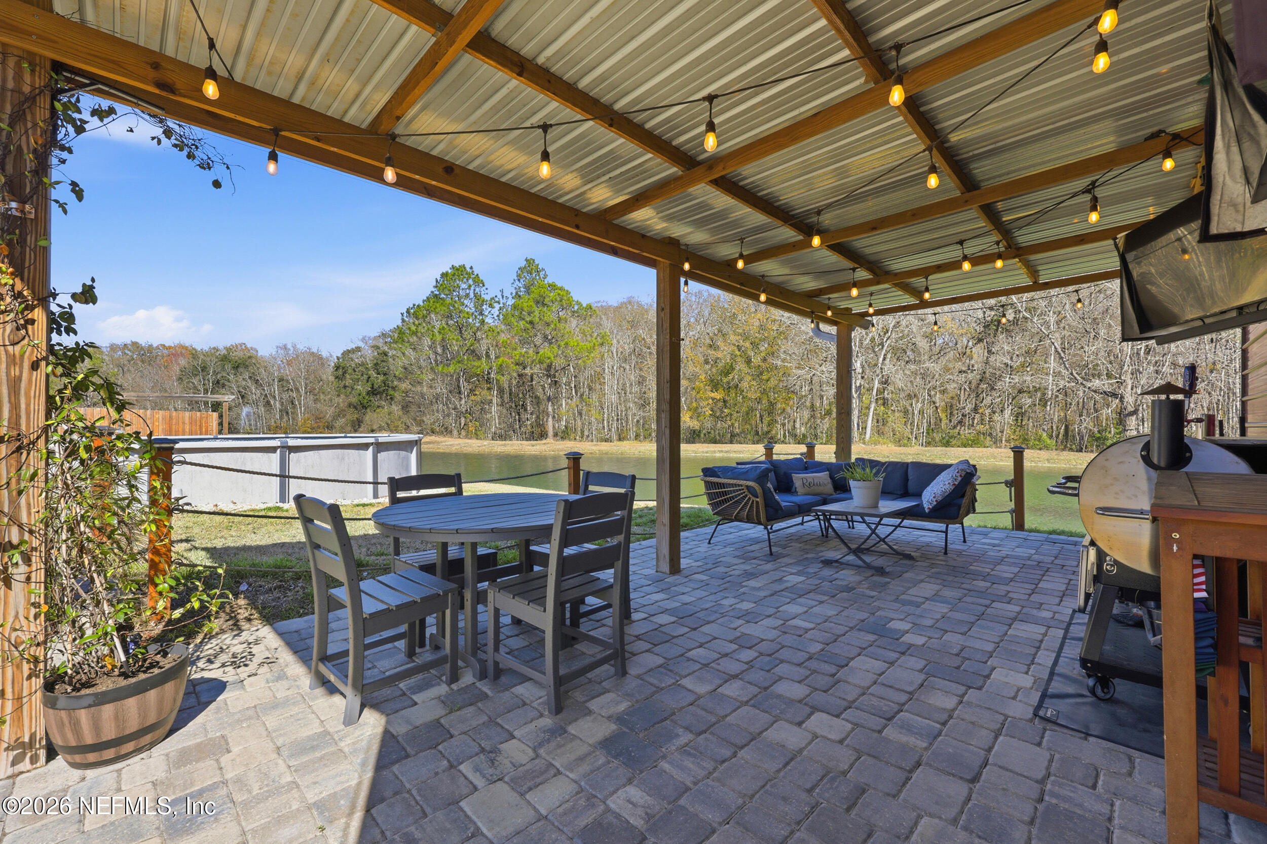 44808 Green Meadows Lane Callahan, FL 32011 - Photo 29 of 41 a view of a tables and chairs in patio