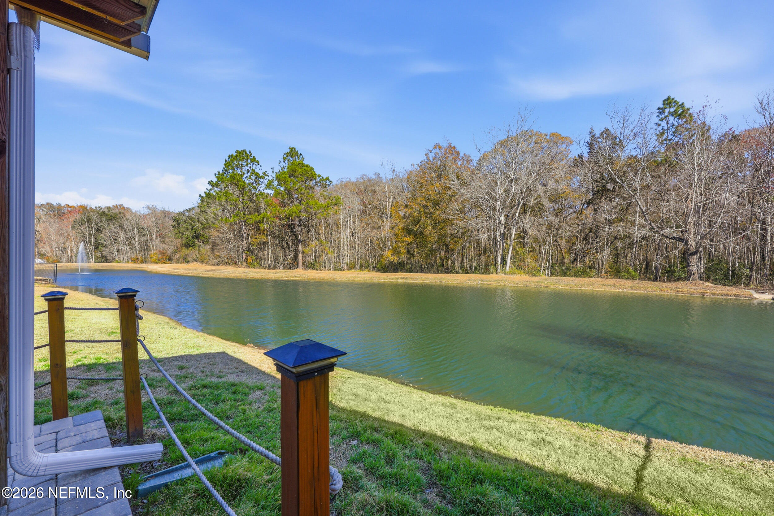 44808 Green Meadows Lane Callahan, FL 32011 - Photo 31 of 41 a view of a lake with a yard from a balcony