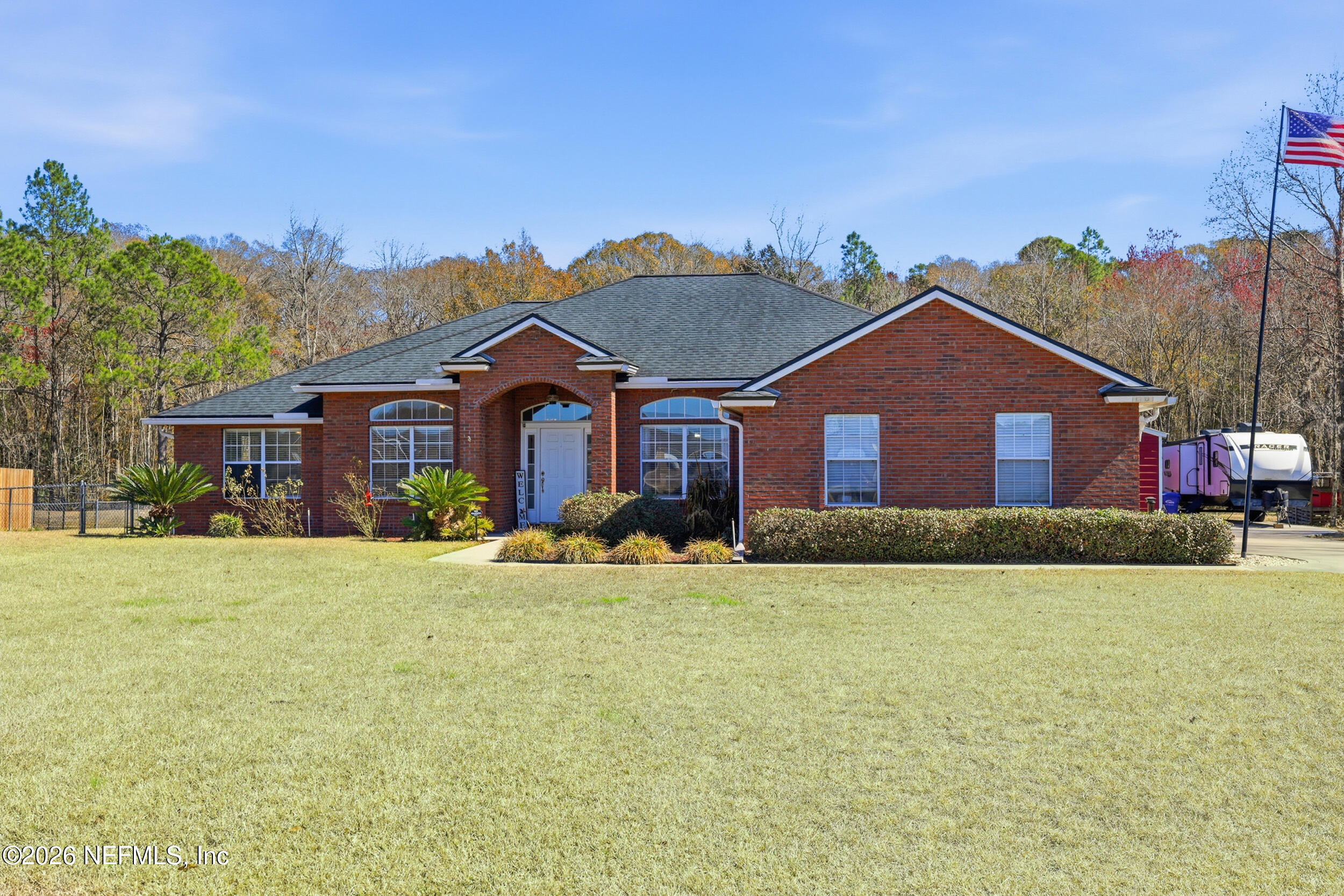 44808 Green Meadows Lane Callahan, FL 32011 - Photo 41 of 41 a front view of a house with a yard