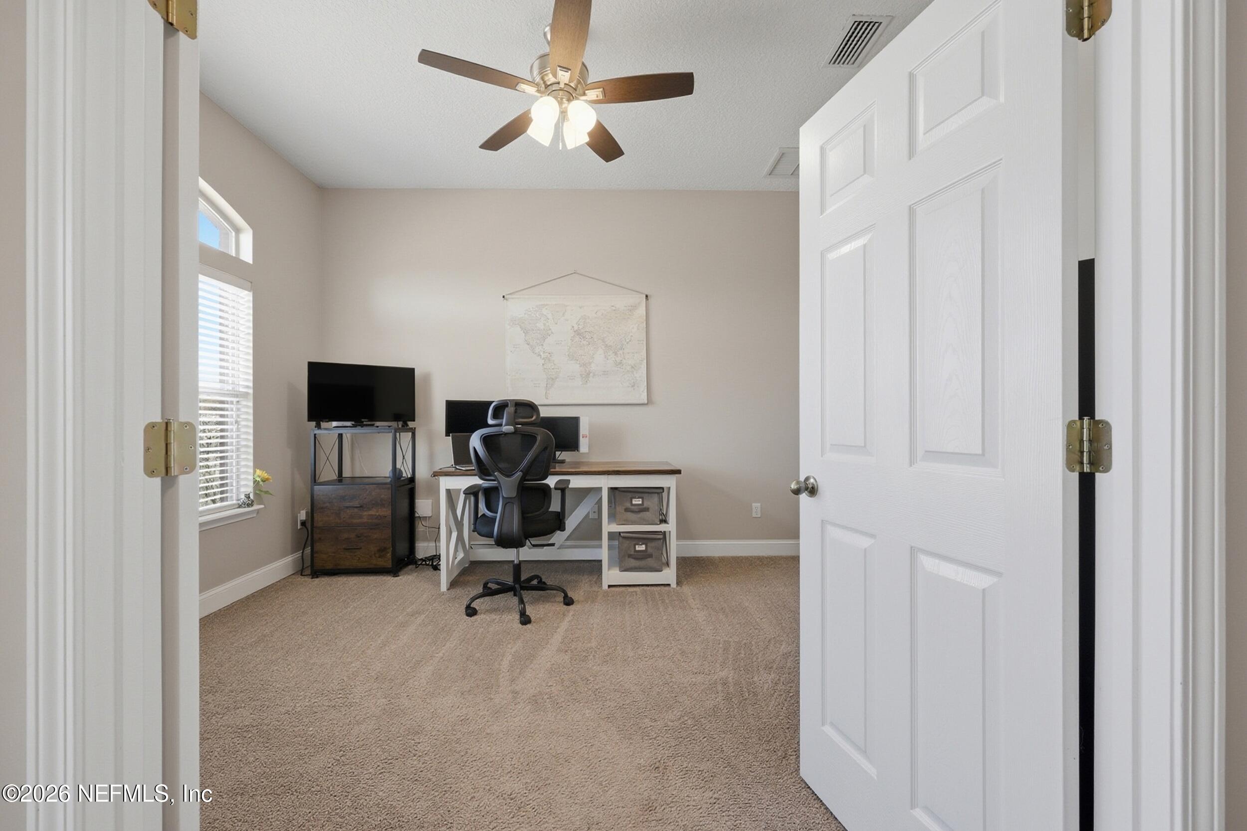 44808 Green Meadows Lane Callahan, FL 32011 - Photo 10 of 41 a view of a workspace with furniture and a window