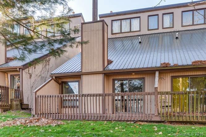 79 Maple Ridge Lane, Unit 79 Asheville, NC 28806 - Photo 2 of 20 a view of a house with wooden fence