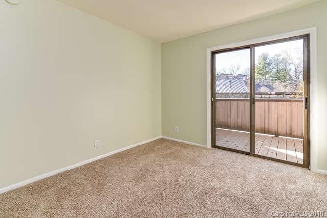 79 Maple Ridge Lane, Unit 79 Asheville, NC 28806 - Photo 11 of 20 an empty room with sliding door