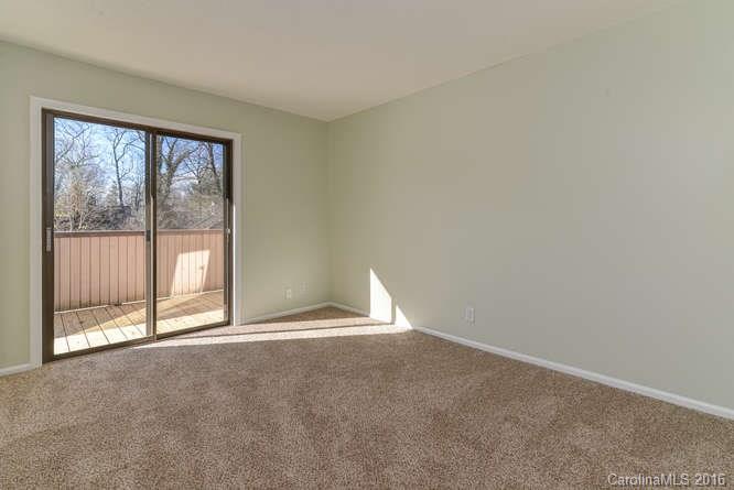79 Maple Ridge Lane, Unit 79 Asheville, NC 28806 - Photo 13 of 20 a view of an empty room with a window