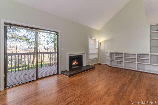 79 Maple Ridge Lane, Unit 79 Asheville, NC 28806 - Photo 3 of 20 a view of an empty room with wooden floor and a window