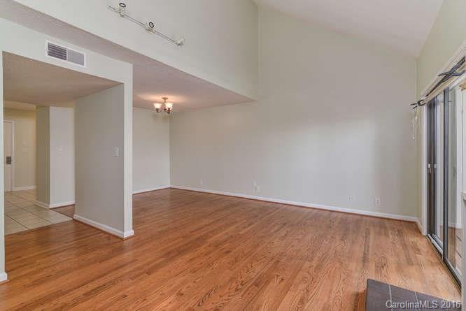 79 Maple Ridge Lane, Unit 79 Asheville, NC 28806 - Photo 5 of 20 a view of an empty room with wooden floor