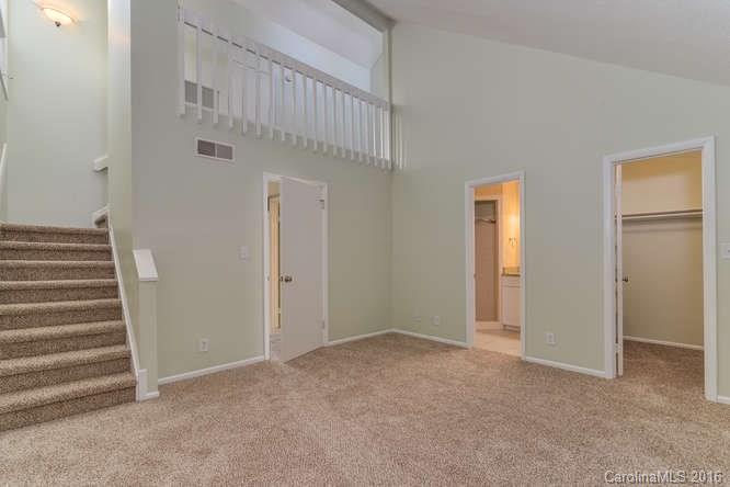 79 Maple Ridge Lane, Unit 79 Asheville, NC 28806 - Photo 8 of 20 a view of an empty room with stairs and closet