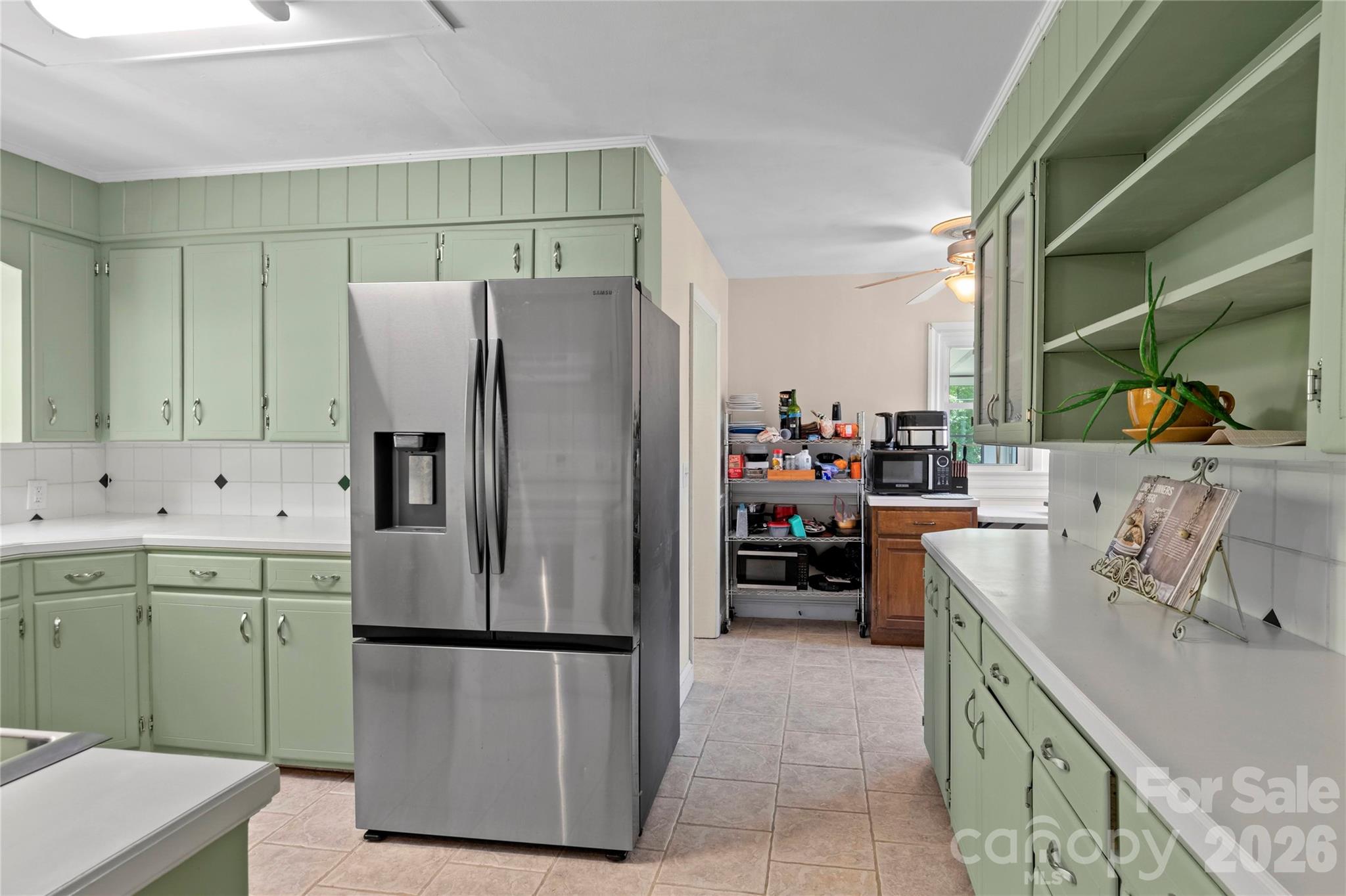 951 Dodson Mill Road Pilot Mountain, NC 27041 - Photo 12 of 48 a kitchen with a refrigerator and a sink