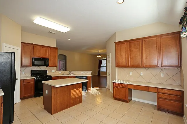 a view of a kitchen with a sink and dishwasher