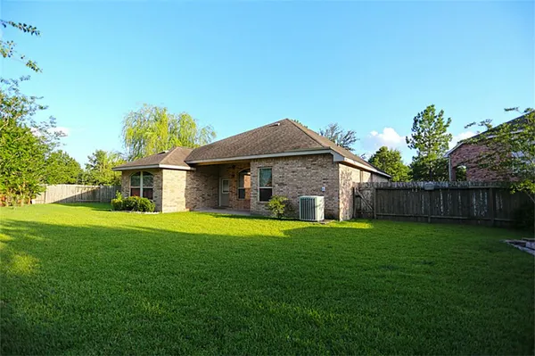 a view of a backyard of the house