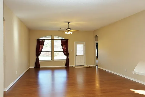 a view of an entryway with wooden floors