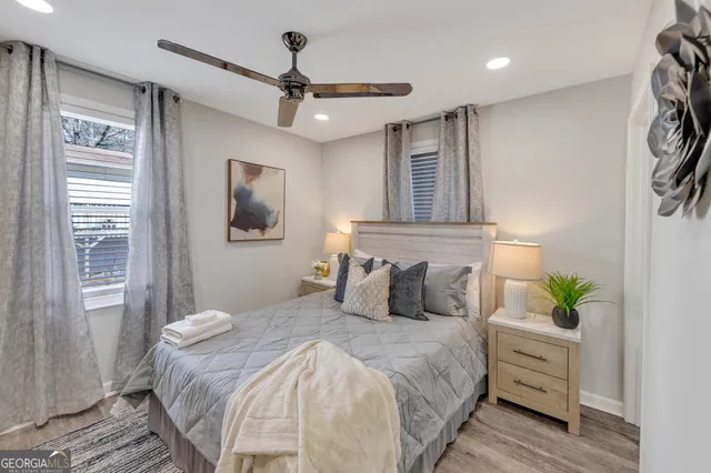 a bedroom with a bed and a window