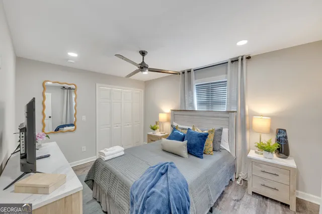 a bedroom with a bed and a desk